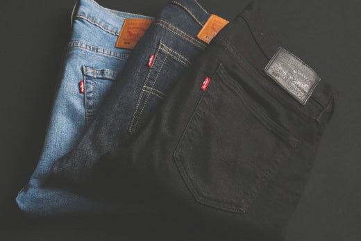 Three pairs of Levi’s jeans in varied washes displayed for fashion inspiration.