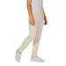 Beige casual pants paired with white sneakers from Jeckerson Men White Jeans collection