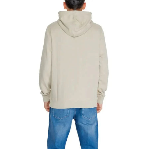 Back view of beige hooded sweatshirt and blue jeans from Calvin Klein Jeans Men Sweatshirts