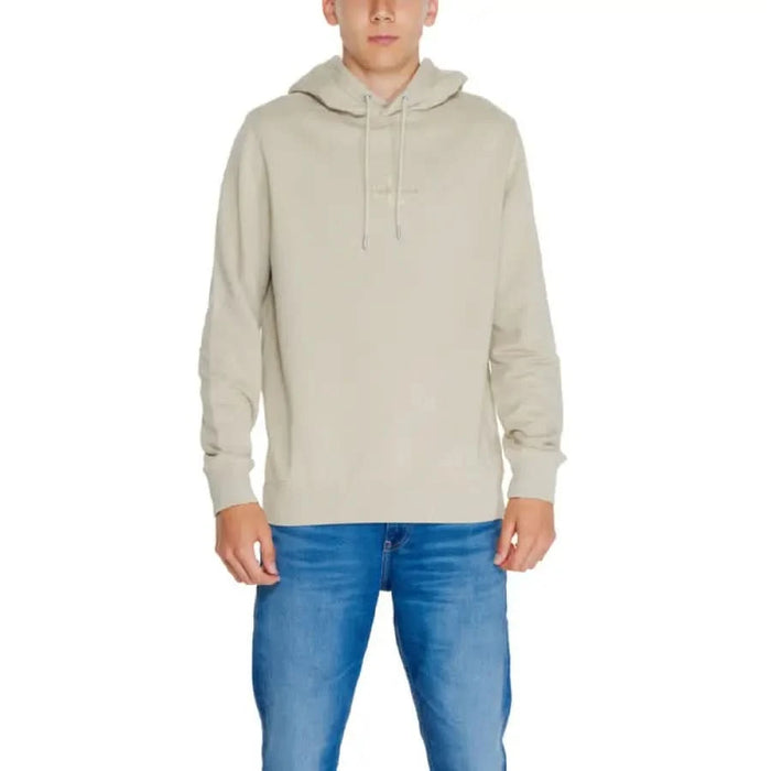 Calvin Klein Jeans Men Beige Hooded Sweatshirt with Blue Jeans Outfit