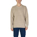 Beige knit crewneck sweater stylishly paired with dark blue pants for men