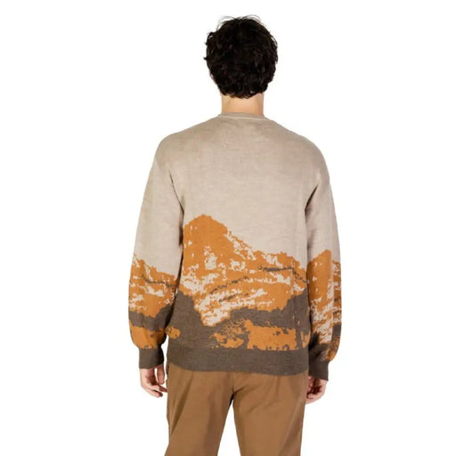 Beige knit sweater for men featuring an orange and brown mountain landscape design