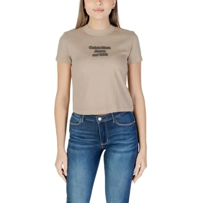 Beige Calvin Klein Jeans Women’s Round Neck T-Shirt paired with blue jeans