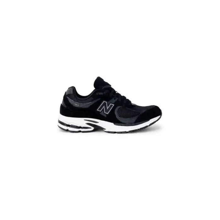 Black New Balance athletic running shoe featuring a white sole for men’s sneakers