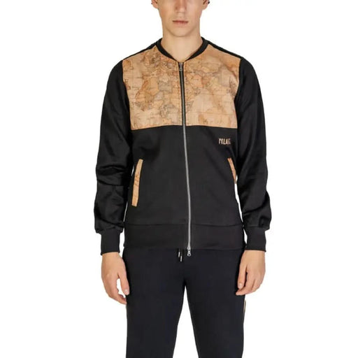 Black bomber jacket with tan map-patterned upper panel and silver zipper by Alviero Martini