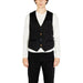 Black button-up vest over white long-sleeve shirt by Gianni Lupo Men Gilet