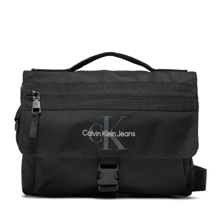 Black Calvin Klein Jeans messenger bag featuring a top handle and front buckle closure