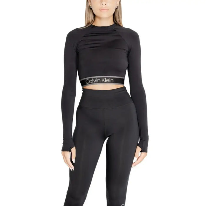 Black Calvin Klein crop top with long sleeves and high neckline for women