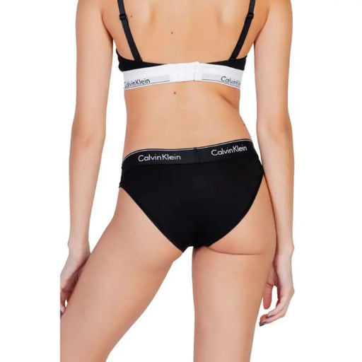 Black Calvin Klein cotton bikini underwear featuring an elastic logo waistband