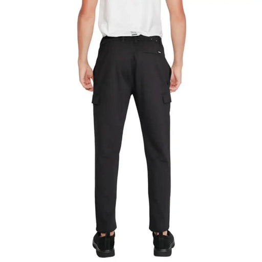 Calvin Klein - Calvin Klein Men Trousers: Black cargo pants worn by a person from waist down