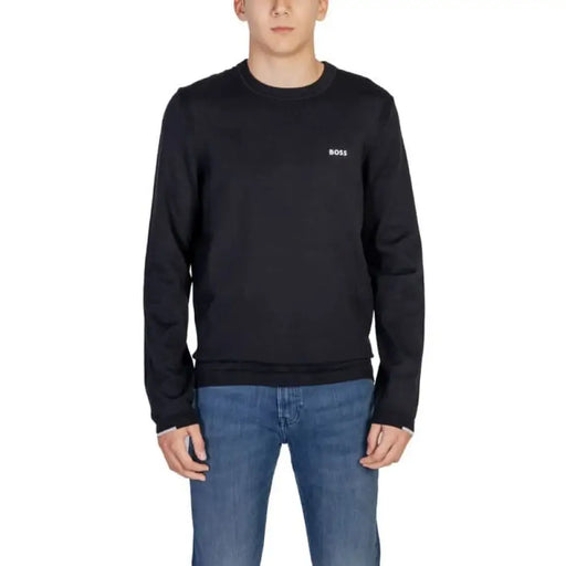 Black crew neck sweatshirt featuring a small Boss logo from Boss Men Knitwear