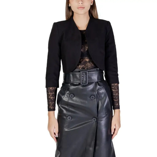 Black cropped blazer with lace sleeves over a leather skirt by Morgan De Toi