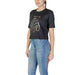 Black cropped Guess Active women t-shirt featuring a stylish graphic design print