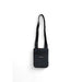 Black crossbody bag with slim profile and adjustable strap by Tommy Hilfiger