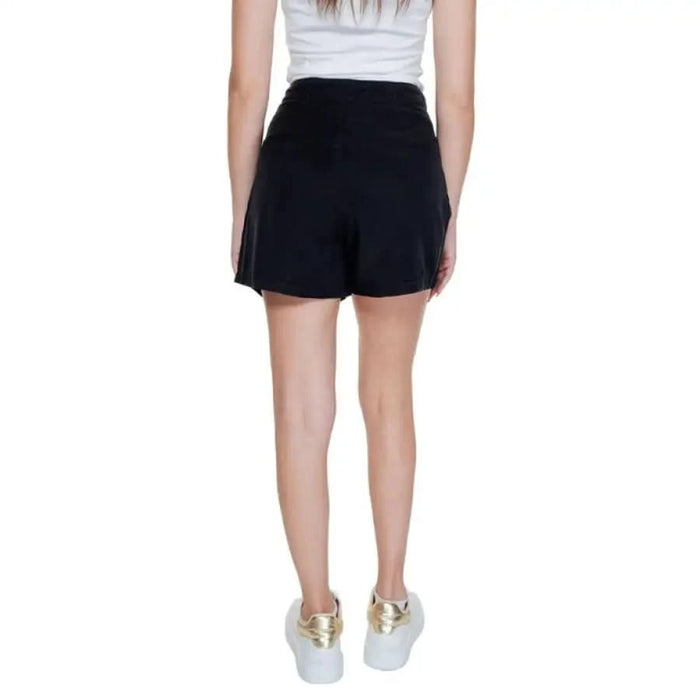 Vero Moda Women’s Black Flared Mini Skirt with White Sneakers featuring Gold Accents