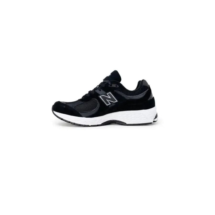 Black and gray New Balance athletic sneaker with white sole for men