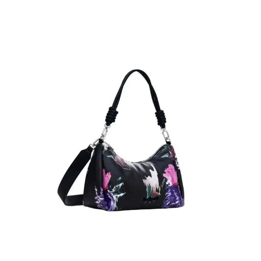 Black handbag featuring a vibrant floral and abstract pattern by Desigual