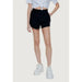 Guess Women Short: Black high-waisted shorts, cropped white top, white sneakers ensemble