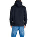 Black hooded sweatshirt and blue jeans by Calvin Klein Jeans, back view