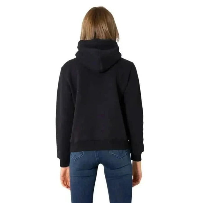 Calvin Klein Jeans women sweatshirt black hoodie worn by person with blonde hair and blue jeans