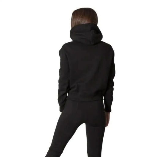 Calvin Klein Jeans black hooded sweatshirt worn by woman, back view