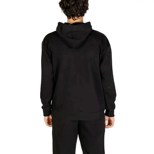 Black hooded sweatshirt displayed from the back for Icon Men Sweatshirts