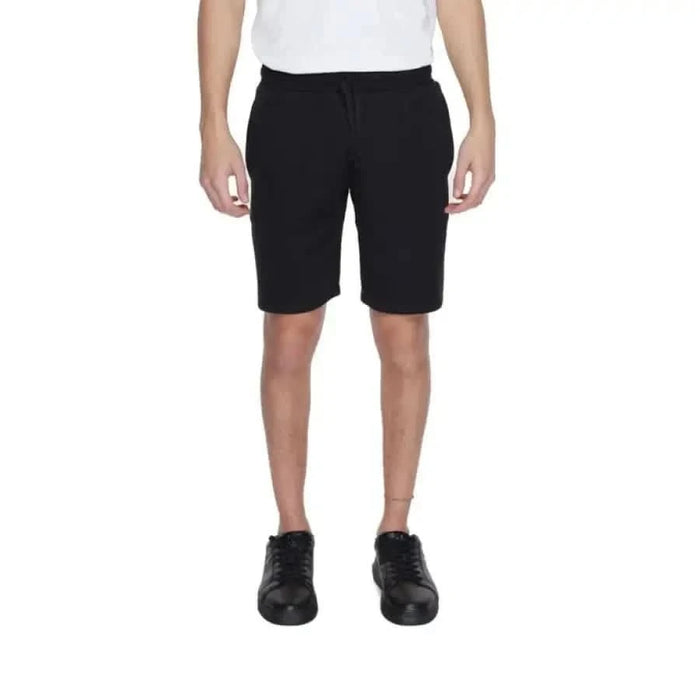 Emporio Armani Men’s Black Knee-Length Shorts worn with White Shirt and Black Shoes