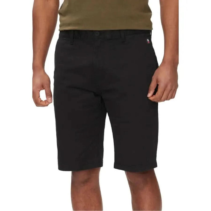 Black knee-length Tommy Hilfiger shorts with pockets and visible waistband for men