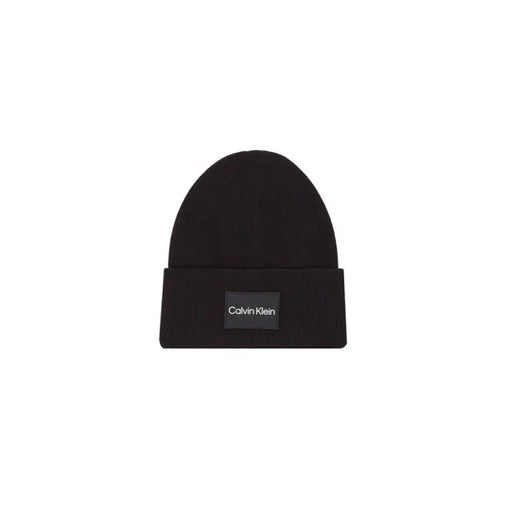 Black knit beanie featuring a Calvin Klein logo patch for men’s fashion accessories