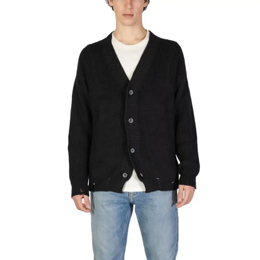 Black knit cardigan sweater with button closure for men, featuring a long low-cut V-neck