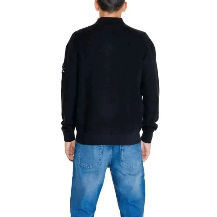 Black knit sweater viewed from the back in Calvin Klein Jeans Men Knitwear collection