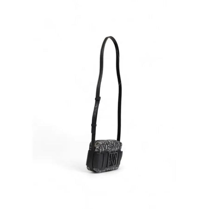 Black leather crossbody bag with textured flap and adjustable strap by Armani Exchange