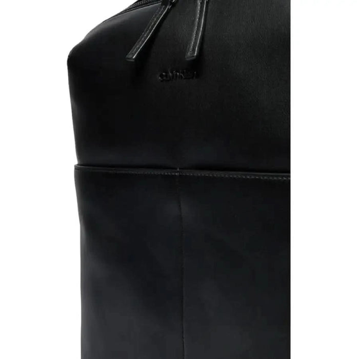 Black leather Calvin Klein Men Bag featuring stitching and zipper closure