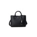 Black leather handbag by Guess featuring a triangular logo and detachable strap