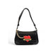 Black leather handbag with red heart emblem and gold chain from Love Moschino