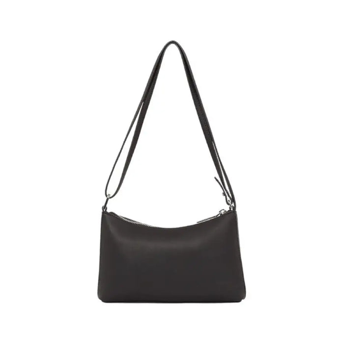 Black leather shoulder bag with long strap and zipper closure by Calvin Klein