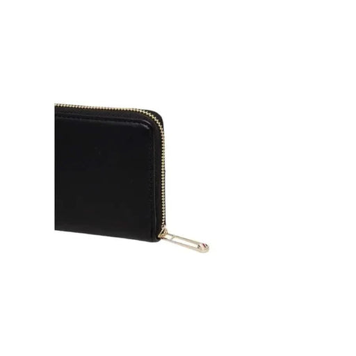 Black leather Tommy Hilfiger women wallet featuring a gold zipper closure