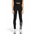 Black leggings with ICON print, styled with a cropped top and silver sneakers