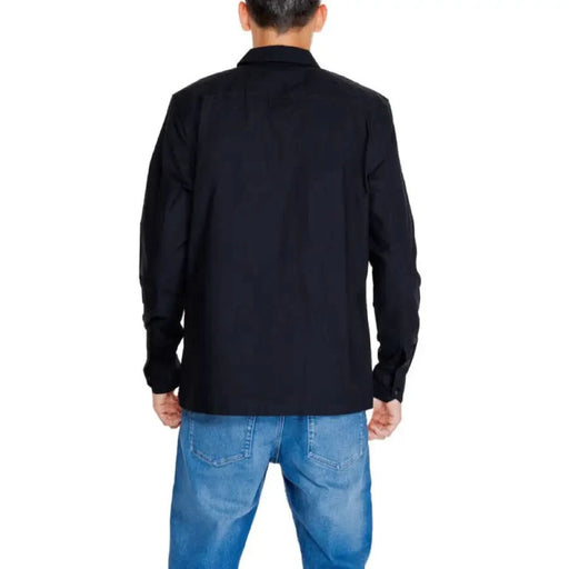 Calvin Klein black long-sleeved jacket over blue jeans, rear view - Calvin Klein Jeans Men Shirt