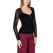 Black long-sleeved top with sheer lace sleeves and partial zipper by Morgan De Toi