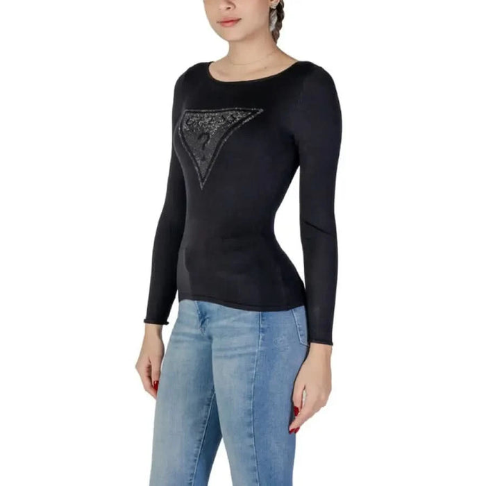 Black long-sleeved sweater featuring a sparkly triangle logo by Guess Women