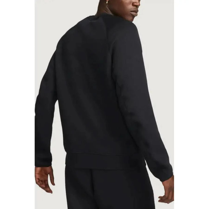 Black long-sleeved Nike Men Sweatshirts or Pullover worn by a person