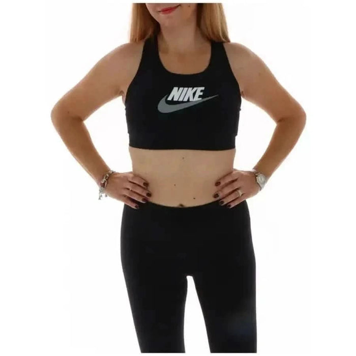 Woman wearing a Black Nike sports bra with hands on hips - Nike Women’s Top