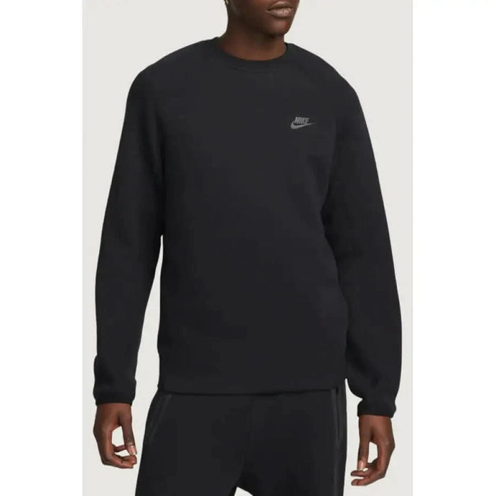 Black Nike sweatshirt with long sleeves worn by person from Nike Men Sweatshirts collection