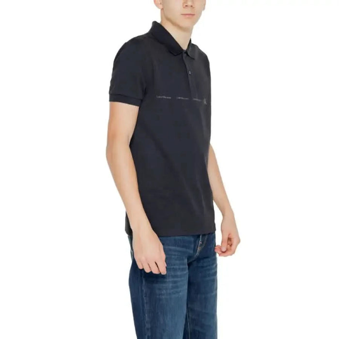 Black short-sleeve polo shirt worn by a person from Calvin Klein Jeans