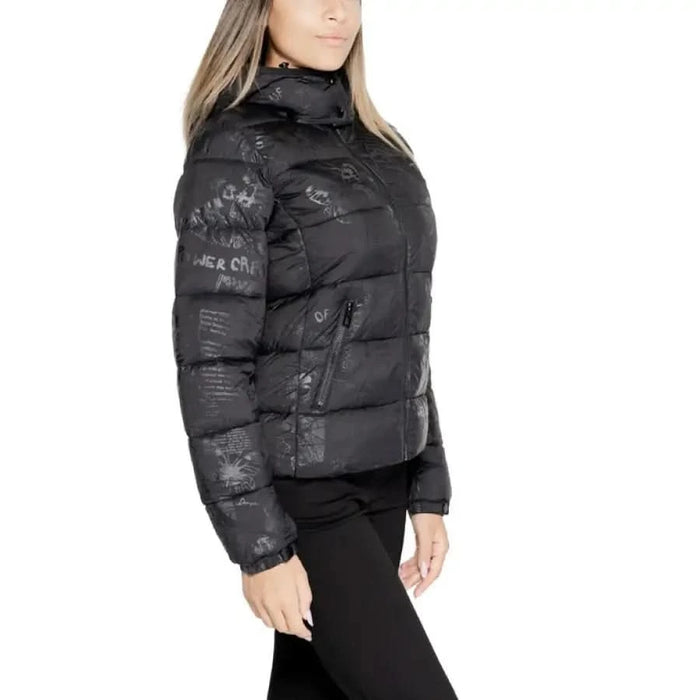 Black Desigual women’s puffer jacket featuring subtle printed text pattern on model