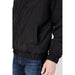 Black quilted bomber jacket by Tommy Hilfiger Jeans featuring elastic cuffs and waistband