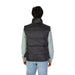 Black quilted puffer vest over light gray sweater from Calvin Klein Jeans