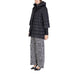 Black quilted puffer coat with hood and three-quarter sleeves by Sandro Ferrone