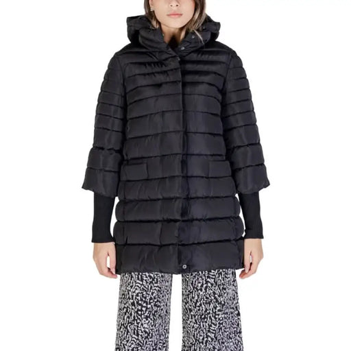 Black quilted puffer coat with hood and ribbed sleeve cuffs by Sandro Ferrone